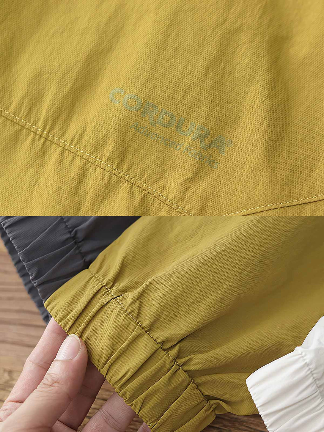 製品画像: 軽量 Cordura ナイロン 速乾トップ 正面、耐摩耗性・リップストップ機能
詳細画像: 両サイドの大容量ポケットと伸縮性のある袖口のディテール、オーバーサイズシルエット