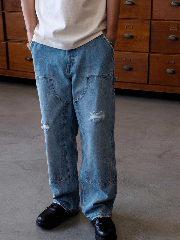 Parolibre | Washed distressed patch denim pants