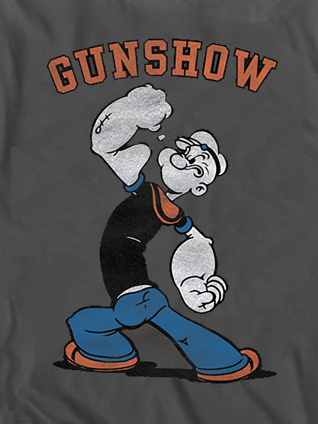 『ポパイ』カートゥーンプリントTシャツの細部画像、筋肉のデザインと「Gunshow」のスローガン